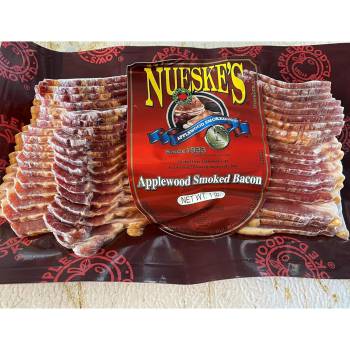 Hand-trimmed and smoked over applewood logs for a minimum of 24 hours infuses the bacon with Nueske’s signature smoky flavor