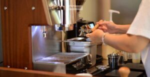 A shaved ice machine is a cylinder surrounded by frozen coils that typically freeze the mixture (flavoring and water) at a temperature well below the freezing point of water